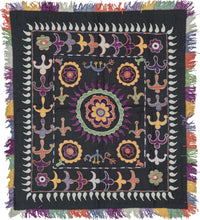 Ilgich are small square embroideries created by Lakai & Kungrat girls to showcase their artistic talents. Traditionally part of a dowry to be displayed prominently in the home. It features circles and vegetal shapes in vibrant tones of yellow, orange, green, bright white and two shades of purple.