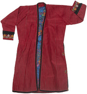 A hand sewn vintage silk chapan or overcoat from the&nbsp;Turkmen&nbsp;of Northern&nbsp;Afghanistan.&nbsp;

A chapan which means "sewn together" in Turkic&nbsp;is&nbsp;an overcoat that&nbsp;is adorned with&nbsp;detailed&nbsp;threading&nbsp;come in a variety of colors and patterns. It is traditionally worn&nbsp;throughout Central Asia.

This lovely chapan is crafted from crimson striped silk. It is embellished with fine black, white, and yellow embroidery around its perimeter and up the sides.