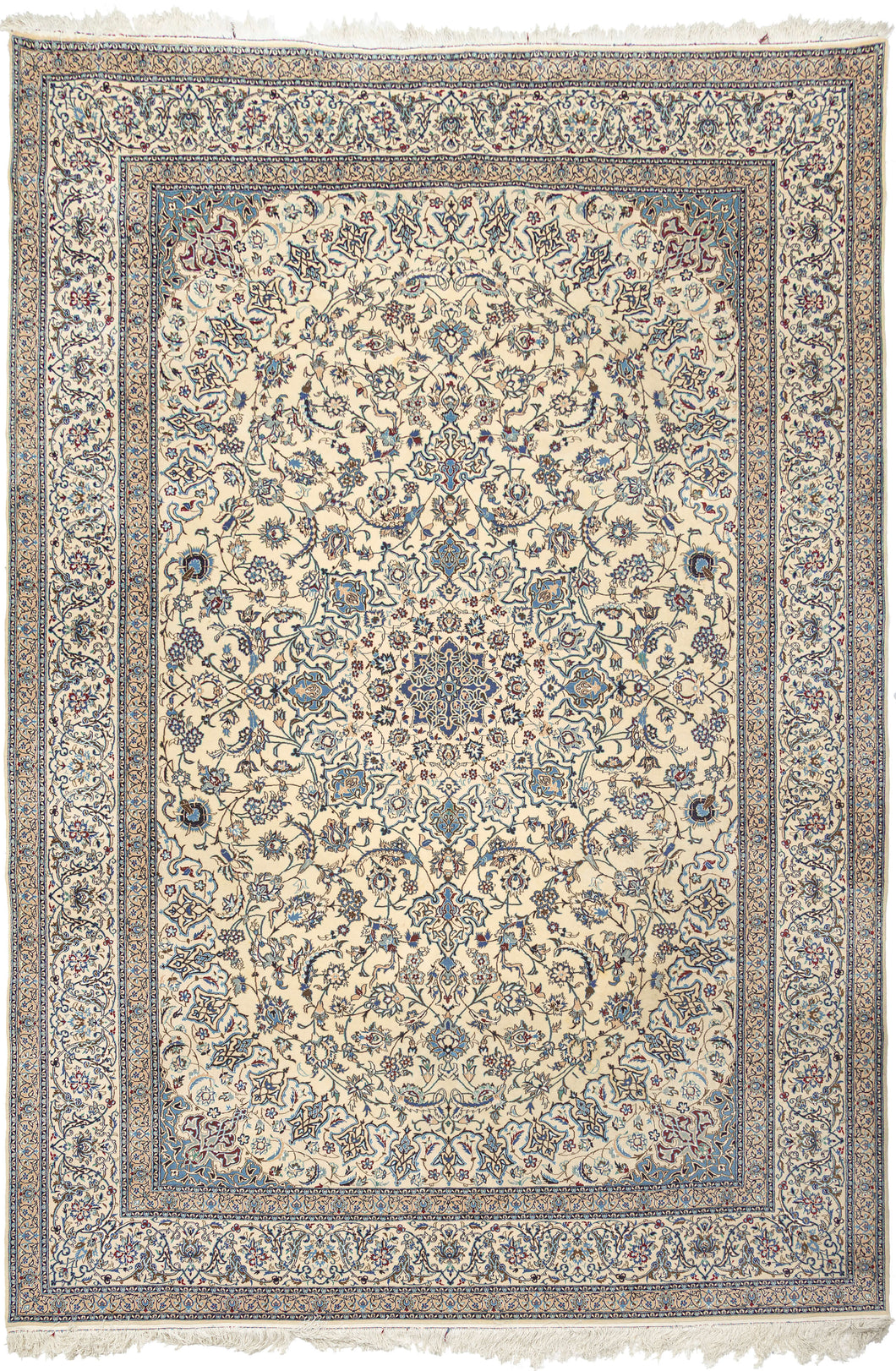 This elegant Nain rug reflects the refined aesthetic that has made these weavings among the most admired of the&nbsp;workshop&nbsp;carpet tradition. Woven on a luminous ivory field, the design centers on a delicate floral medallion surrounded by an exceptionally graceful network of scrolling arabesques, palmettes, and finely drawn flowering vines. A restrained palette of ivory, sapphire, powder blue, taupe, and soft celadon creates an atmosphere of quiet sophistication while allowing the intricate drawing t