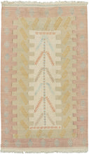 Silk Syrian It features a lovely directional motif reminiscent of a tree of life with rows of "S"s on top and bottom. Various interlocking blocks both emphasize and celebrate the interlocking tapestry technique utilized. A soft and delicate palette of faded blush, warm gold and muted celadon give it an ethereal almost dreamlike quality perfect matching it's materially.