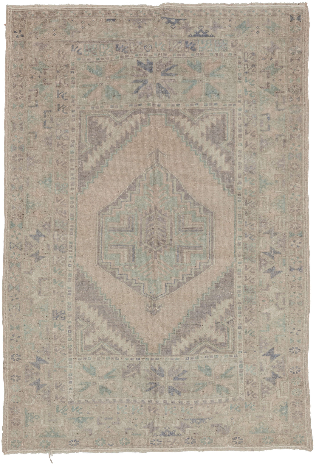 A softly washed Oushak with a luminous, pale field and gently articulated geometric medallion. Muted celadon, faded lavender, and warm ivory tones blend seamlessly, creating an airy, time-softened surface with subtle movement.