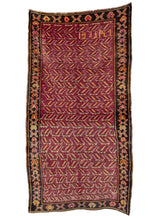 Armenian rug handwoven in 1935. Uncommon geometric composition in yellow and red on a rare purple field. Border has abstract geometric shapes on a dark brown field. 