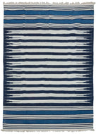 19th century Indian Jail dhurrie featuring a series rows of deep navy and bright white stripes which feather at each end in the central panel. Two skirt panels feature smaller alternating white and navy stripes broken up by two bright indigo blocks. These rugs were part of prison reform beginning in 19th century India.