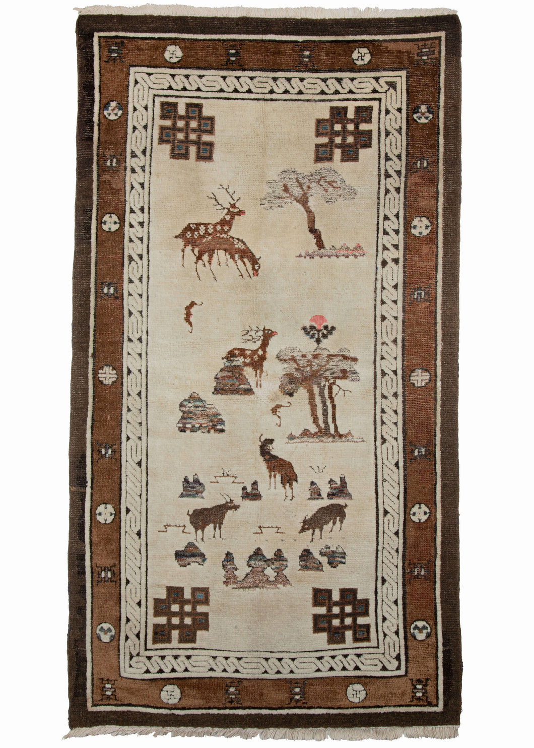 19th century small Mongolian rug depicting a natural scene primarily of a variety of animals among trees and stones. Among the animals, deer, bats, goats and a pig can be found. The stones have the appearance of scholars' stones and are rendered in a lovely combination of blues, purples, and browns. Four eternal knots can be found in each corner. 