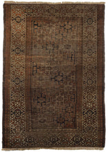 Afghani Baluch rug that features a simple and straightforward palette of deep reddish brown, navy, beige and ivory. It is composed of a field of latch hooked squares on the diagonal surrounded by a border of 8 pointed stars. 