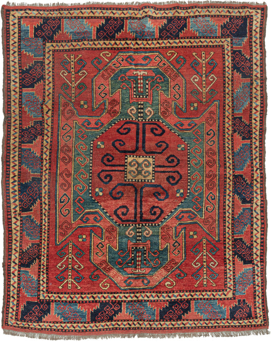 Vintage Afghan Kazak sewan design area rug featuring a classic rendition of the sewan design usually found in the Caucasus but rendered in classic tonality and construction of the rugs found in Northern Afghanistan. The strong shield-like medallion is rendered here in a rich red, jade, and terracotta and framed by a powerful border of serrated leaves that alternate between navy and sky blue.