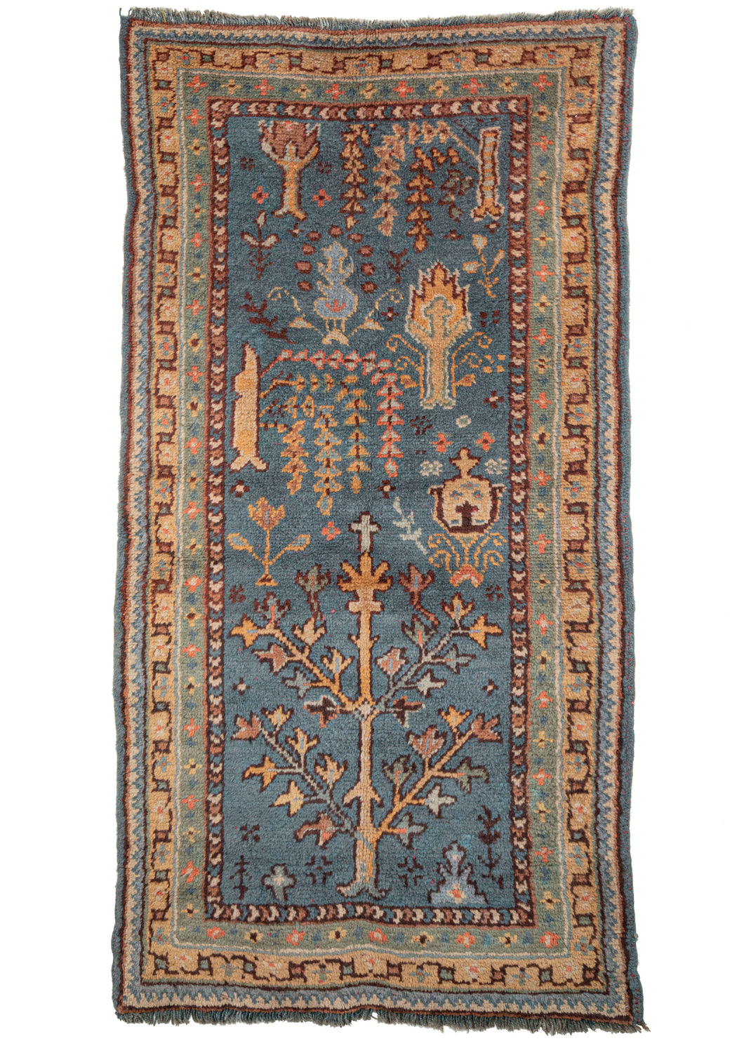 Anatolian Turkish Oushak sampler area rug featuring a variation of a Bid Majnun or weeping willow design. It is rendered asymmetrically and with the composite motifs at different scales. The pleasing palette includes soft yellow, green, coral, and brown, and wonderful blue-green ground. 