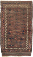 This Baluch rug was handwoven in Afghanistan during the second quarter of the 20th century.   This rug features an all-over field of geometric devices in blues, pinks and browns on reddish brown ground. Framed by multiple borders including meandering "S" scrolls most prominently one in a vibrant white that really pop. Nicely finished with kilim skirt borders each side with their own distinctive weft float embellishment.