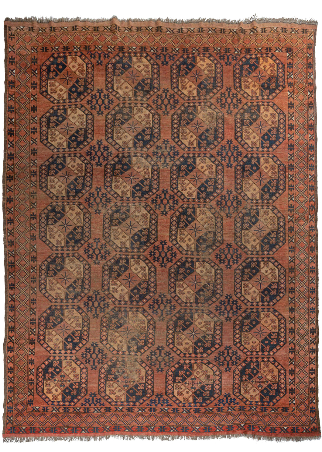 Antique Central Asian Ersari Turkmen rug featuring a traditional Ersari gül design on a soft peachy-pink ground, with soft orange, brown and navy completing the color palette. The colors varies slightly throughout with a moment of deeper red near one end.
