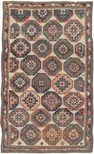 Antique Caucasian Kazak rug featuring offset Memling guls in primary colors of red, blue, and yellow on a soothing ivory ground and framed by an interlocking sawtooth border. Some guls become distorted as these reach the edges. Gentle abrash, wonderful spacing, a pleasing palette, and just enough wonkiness make this a very satisfying piece. 