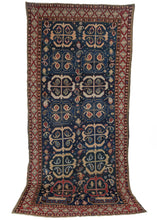 Antique Caucasian Shirvan wide runner kelleghi featuring an all over pattern of boteh encapsulated within ram’s horns in yellow, peach, ivory and red on vibrant blue field. It appears the weaver initially considered a memling gul field before shifting to the rams horn motif as evidenced by the partial pattern near the bottom edge.
