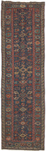 Antique Caucasian soumak runner featuring a repeat geometric pattern in rich jewel tones of reds, pinks, blues, greens, and yellow with accents of ivory and brown. Nicely framed by a wide main border of alternating palmettes and serrated leaves and finished with a minor "running dog" border. The distinctive running dog border is well documented in Seychour rugs of the Northeast Caucasus where Russia and Azerbaijan meet.
