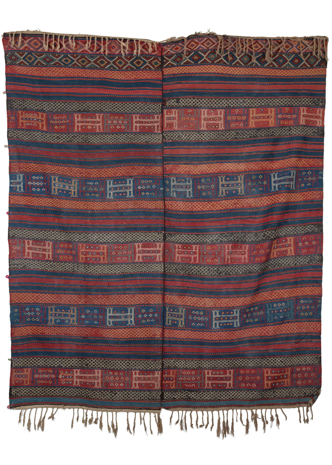 Antique Caucasian Verneh weaver's kilim woven in two strips seamed in the center it features bold kilim stripes of blue and red with an over-lapping soumak pattering in yellows, blues, red and white. 