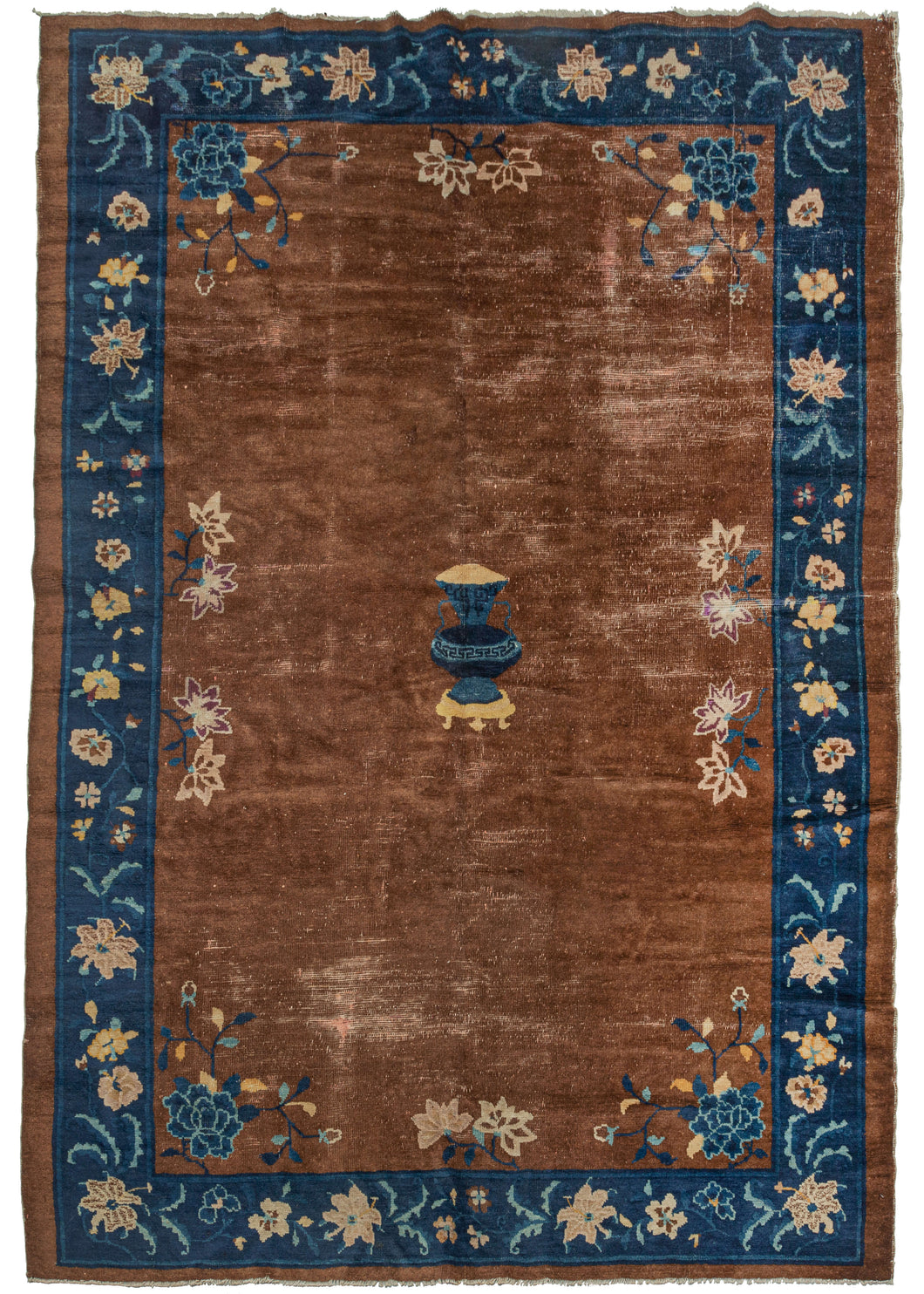 Antique Chinese Peking area rug featuring a deep chocolate field with an indigo blue border. A central vase motif is framed scrolling blossoming lotuses in the corners of the field. The main border contains an elegant floral motif that blends in seamlessly.