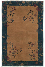 Antique Chinese Fa-ti scatter rug featuring a golden yellow field with a wide indigo blue border. The simple floral design spans the four corners of the rug, and features light blue, gold, and purple details. 