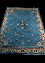 Antique Chinese Peking rug with sky blue field and pale pink and yellow border