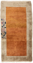 Antique Chinese small deco runner featuring a straightforward yet vibrating golden field framed by a silver border. A single branch blossoms on side of the border. Lovely color selection and subtle nuance in tone make this piece impactful.