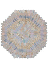 Antique N American quilt based on a rectangular hexagonal quilt block (pattern) that starts in the center and expands out. It is composed of pieced together fabrics, most probably recycled materials from around the home. The scalloped edge of the quilt suggests this piece was sewn by an expert quilter. 