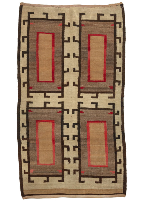 This Navajo Rug features a symmetrical design of four hooked concentric rectangles on an ivory ground. Each central rectangle is a lovely golden hue outlined in a vibrant red on an undulating gray ground. The uneven fading of the red makes it appear to glisten. The combination of the latch hooks and the open space with the glistening reds, undulating gray, and gold give the piece a spectacular movement and liveliness.