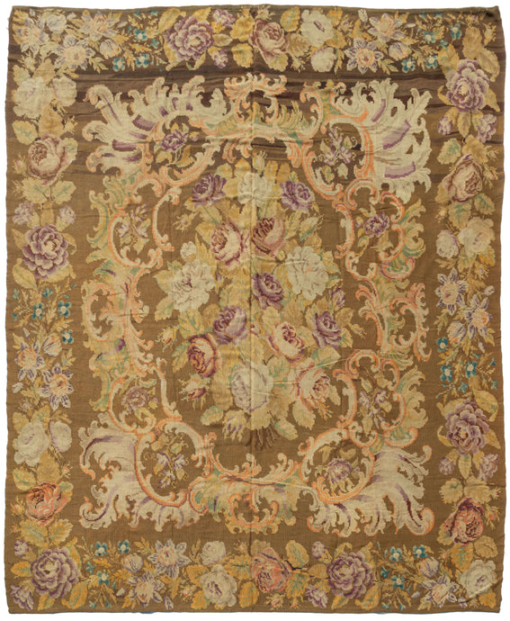 Antique Moldovan Kilim featuring a central bouquet of plush cabbage roses in soft purples, delicate oranges and ivory framed by orange baroque 