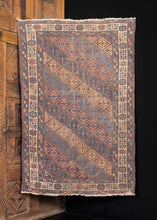 Antique NW Afghani Baluch rug with all over pastel diamond pattern.