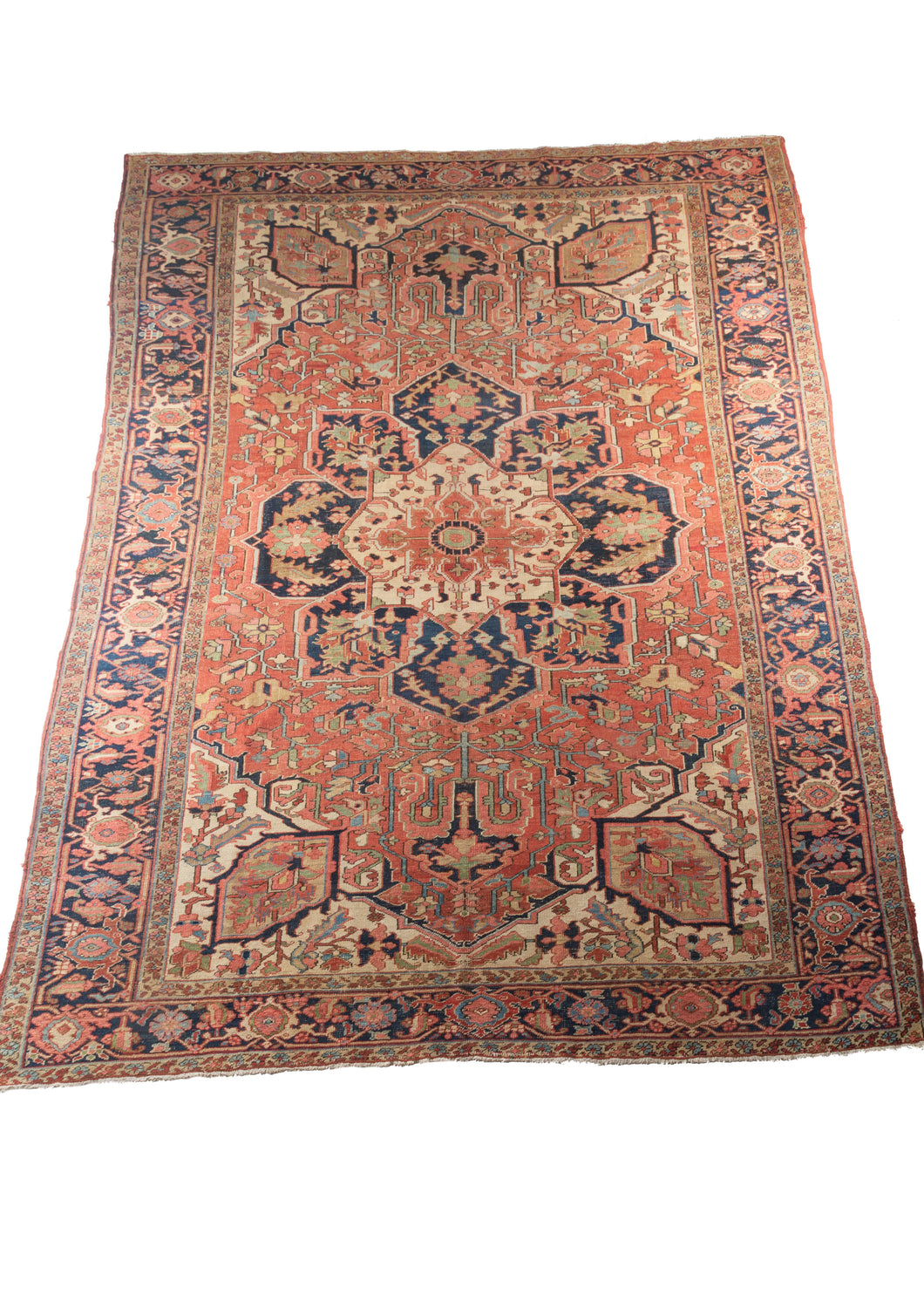 Antique NW Persian Baby Serapi Heriz Room size Rug with a central medallion and fine patina in the softened natural dyes and grounding through the deep indigo blue