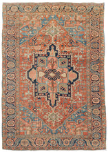 This Heriz rug features a classic Heriz patterning with a strong geometric central medallion on a madder red ground. The four cornices mirror the design from the medallion in a different color combination. The main border is composed of an alternating rosette and serrated leaf pattern, while the minor borders feature floral meanders. It is woven with the coarseness and feel of 20th century Heriz rugs, but a palette more associated with earlier Serapi rugs. 