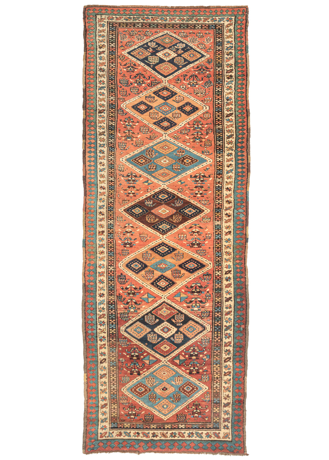This Antique NW Persian Runner features large diamonds in orange, brown, light, and dark blue on a brick ground. Each diamond is filled with five further diamonds 