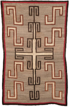 Antique Navajo rug featuring an elegant geometric design. The shapes are woven in undyed cream wool and outlined in black and brown wool. A red and black border frames the whole. 