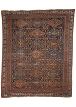 Afshar rug handwoven in Southern Iran during the early 20th century. All over pattern of diamonds in alternating colors. Variations of reds, blues, browns and ivories add depth. 
