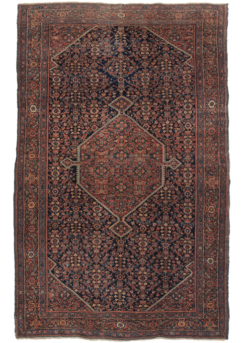 Antique Farahan Rug features a navy ground Herati design field with cornices and a central polygon medallion utilizing a red ground Herati pattern. A fun play of pattern and color that is finely woven and well-executed. The main border is a detailed scrolling palmette design with two minor borders of alternating rosettes.