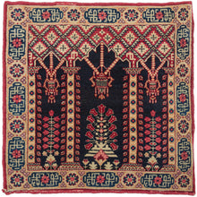 Antique intricate Kerman small weaving featuring a directional architectural scene of hanging lanterns and blossoming flowers. It is comprised of rich tones of rich tones of indigo, ivory, raspberry, and wheat which contrast well giving the drawing depth against the navy void. It is framed by a border of alternating rosettes and cartouches. The cartouches are filled with a faux kufic script. 