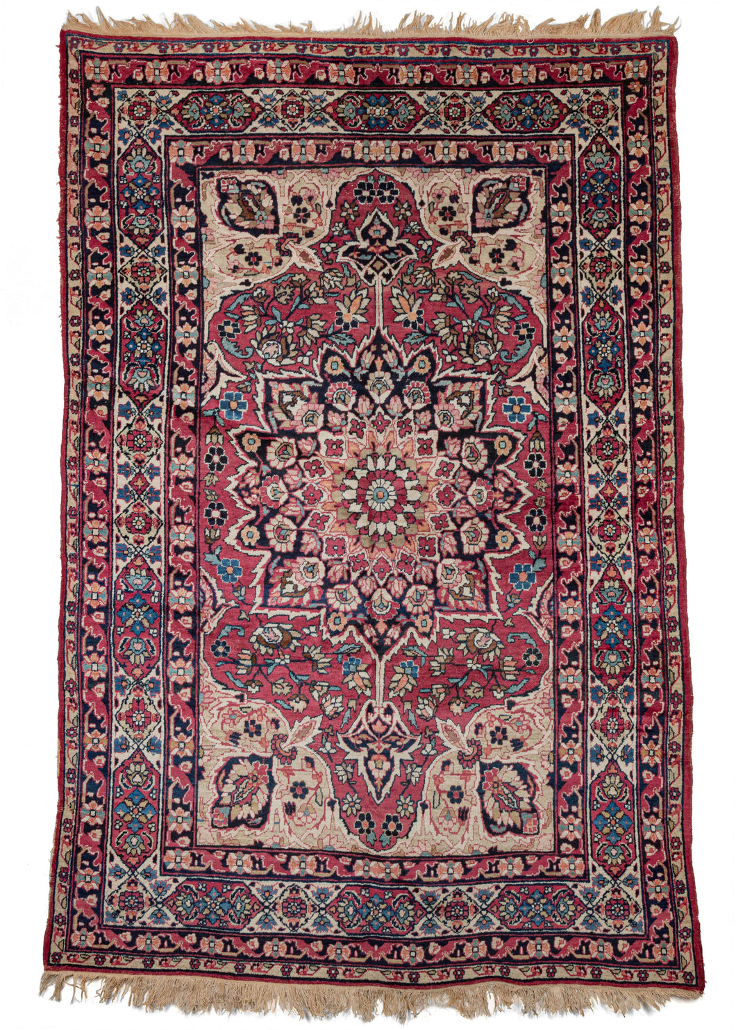 Antique Persian Lavar Kerman rug featuring a central medallion with a curvilinear floral design and scalloped cornices. The field is a rich raspberry color, nicely contrasted by the lighter pinks and creams of the cornices. The minor borders are composed of vine and leaf motifs, while the main border contains alternating blossoms in diamonds and cartouches. 