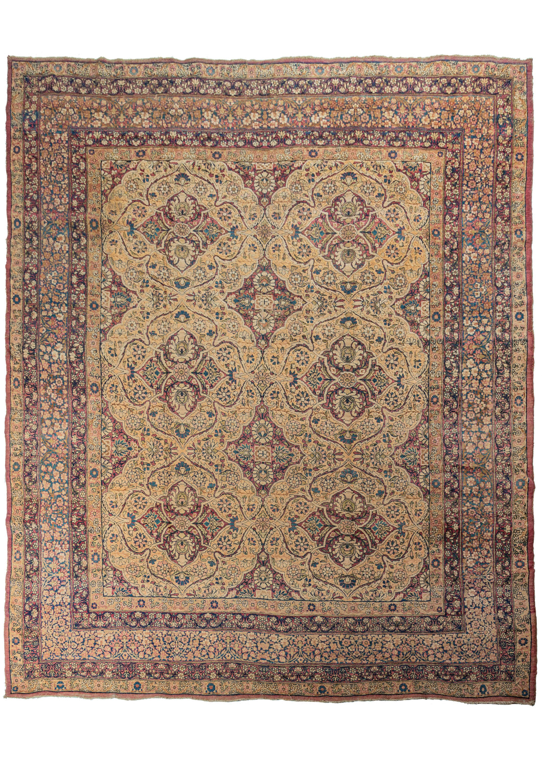 Antique Persian Lavar Kerman carpet featuring a curvilinear floral design with six scalloped medallions and is finely woven in golden yellow and wine purple. The design plays with positive and negative space in a sophisticated and subtle manner. The five borders are just as elaborately patterned as the main field, continuing the curvilinear floral motif. They are composed of varied sprigs and meanders and show off the artful use of indigo blue for the details.   