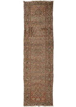 This Malayer runner was woven in Western Iran during the second quarter of the 20th century.  It features a field a brown and rust Herati patterned field on ground which shifts from dark slate to icy blue. A calm and muted palette with some moments of pink and yellow  It good condition and some areas are worn to the foundation. The previous restoration was done with some coloration added (as pictured)