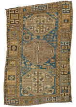 This Caucasian Shirvan Rug eatures a wonky rendering of three off-kilter medallions on a ground chock full of various unbalanced protection symbols. The whole is framed by a border of hooked lozenges that dramatically shift in scale and play with perception.