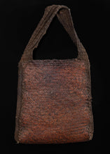 Vintage handwoven New Guinea Highlands bag.  This woven bag is braided with thin strips of rattan, giving it a stiff and sturdy form. This type of bag is called aenkiya nuw and was used by older men during ritual ceremonies and to carry accessories like tobacco pipes.   In excellent condition, signs of wear consistent with age. 