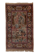 Small pictorial rug handwoven in India, featuring a variety of animals in a forest setting, and a rider on horseback. In excellent condition, signs of wear consistent with age. 