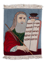 Vintage handwoven rug, featuring Moses holding the stone tablets with the 10 commandments. In perfect condition, with original fringe; signs of wear consistent with age.