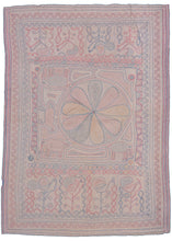 Bengali Kantha featuring an off-center mandala with reciprocal panels on top and bottom. The central mandala is squished to one side by three elephants and one horse form. The top and bottom panels both feature a row of plant forms that blossom into birds. Soft red, blue, and yellow on a soft pink ground. 