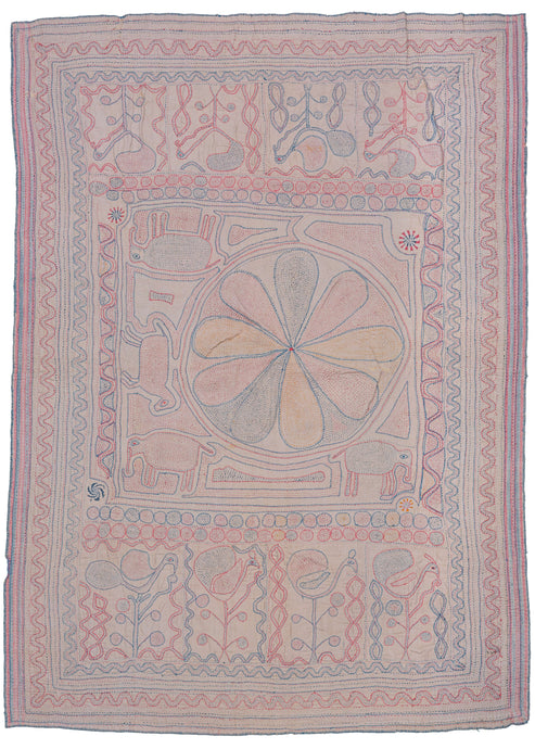 Bengali Kantha featuring an off-center mandala with reciprocal panels on top and bottom. The central mandala is squished to one side by three elephants and one horse form. The top and bottom panels both feature a row of plant forms that blossom into birds. Soft red, blue, and yellow on a soft pink ground. 