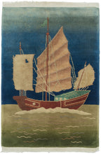 This Art Deco rug was handwoven in Tientsin, China during the second quarter of the 20th century.  It features a detailed and expertly rendered clipper ship against a vibrant blue sky and on a lively green sea. 