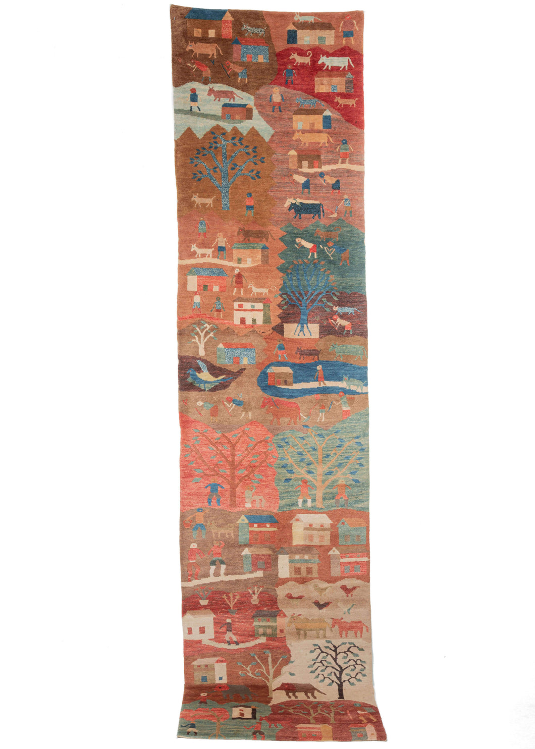 Colorful village life Tibetan Natural dyed runner featuring a fun a whimsical village scene more reminiscent of a folk painting than a rug. For this collection, the weavers used natural dyed wool and free reign to create an expression of village living. Vibrant scenes featuring people, animals, homes, and agricultural production play out in jewel-toned blues and greens atop earthy ochres.