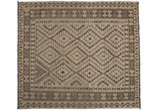 This Contemporary Maimana kilim was woven in Afghanistan during the 21st Century.  It features classic Maimana patterning of stepped diamonds but in a neutral palette of soft browns, gray, and ivory. A versatile piece with a calming presence.  In excellent condition, flat-woven with a substantial handle.