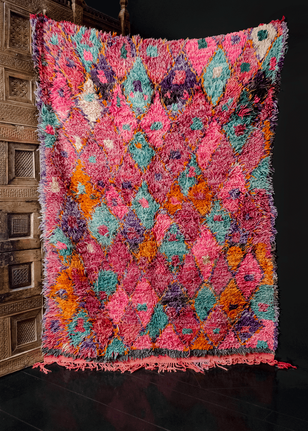 Mid century Moroccan Beni rug. Borderless design composed of diamonds woven in a bright multicolor palette of bright pink, teal and burst of orange, purple and ivory. 