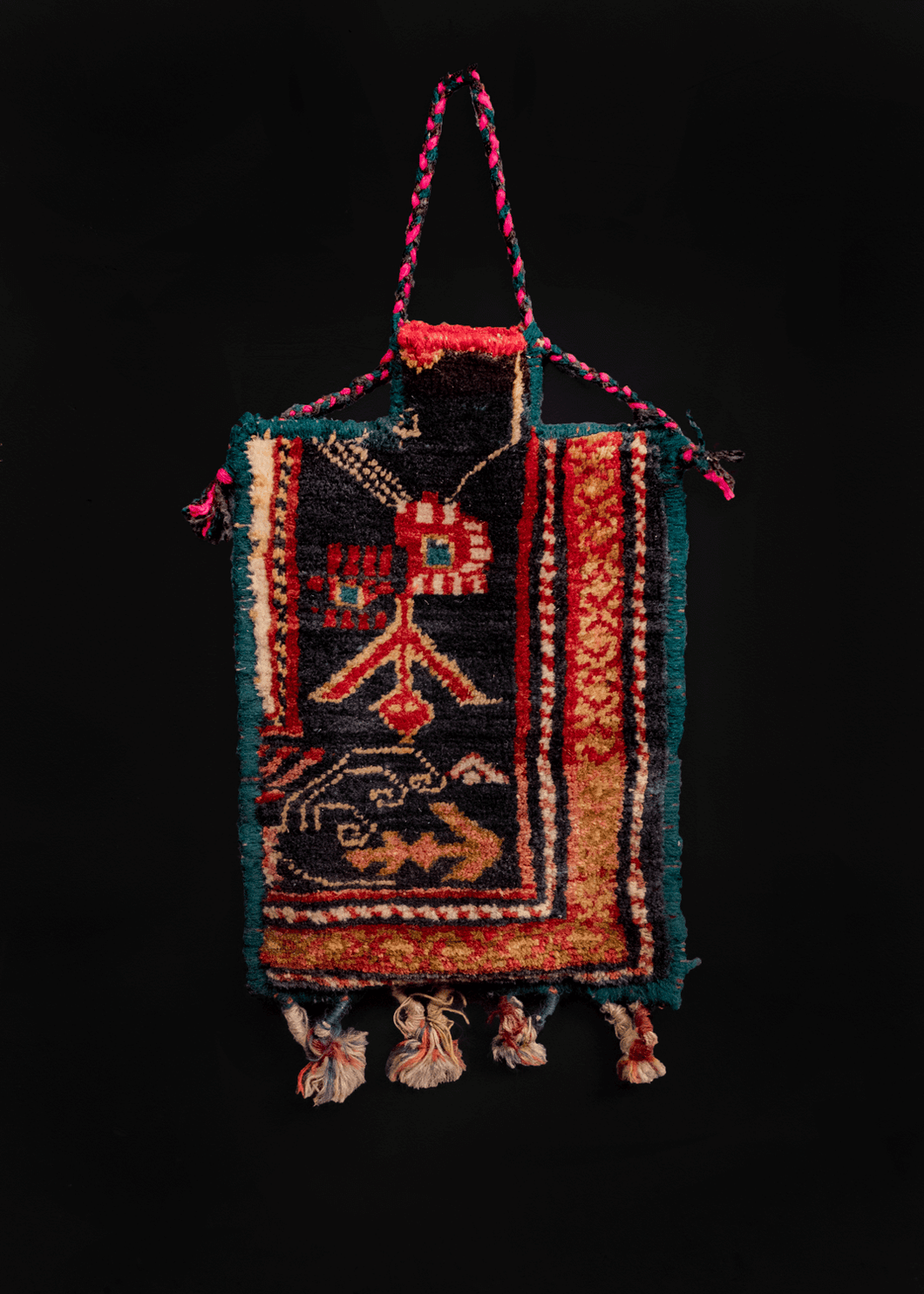 Vintage Armenian salt bag. Pile front with a flat woven back. Decorative tassels hang at bottom. 