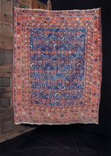 Afshar rug handwoven in Southeast Iran during the first quarter of the 20th century. All-over abstracted herati design of flowers and leaves on an electric blue field. Main border features daintily woven flowers. 