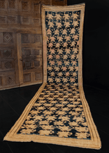 Armenian runner woven during second quarter of 20th century. Repeating pattern of soft pink and khaki roses on inky black field. 