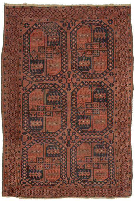 This Ersari Turkmen Rug features a traditional Ersari gül design on a soft brick ground, with oranges, and navy small ivory accents completing the color palette. The guls progressively stretch from rounder to more oval from top to bottom. In a hard-to-find and highly desirable mid-size.