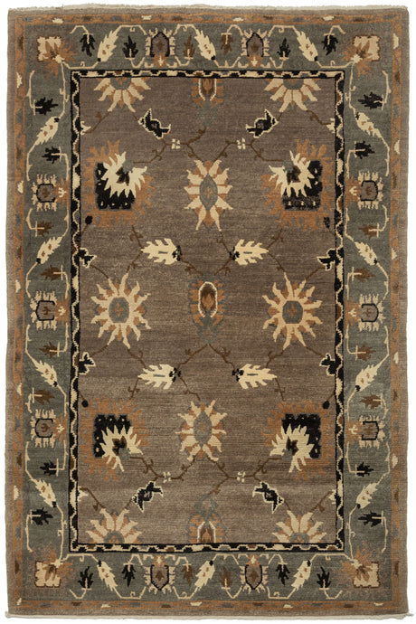 This Vintage Tibetan Tufekian features an open field of various palmettes on a spacious grid framed by a border of scrolling palmettes on a similar scale. The whole composition is rendered in a simple yet uncommon palette of black, ivory, copper, gray, and brown.